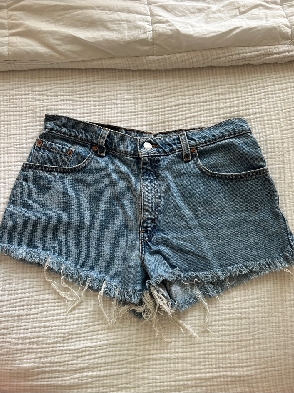 Vintage Levi's Light Blue Frayed Hem Denim Shorts